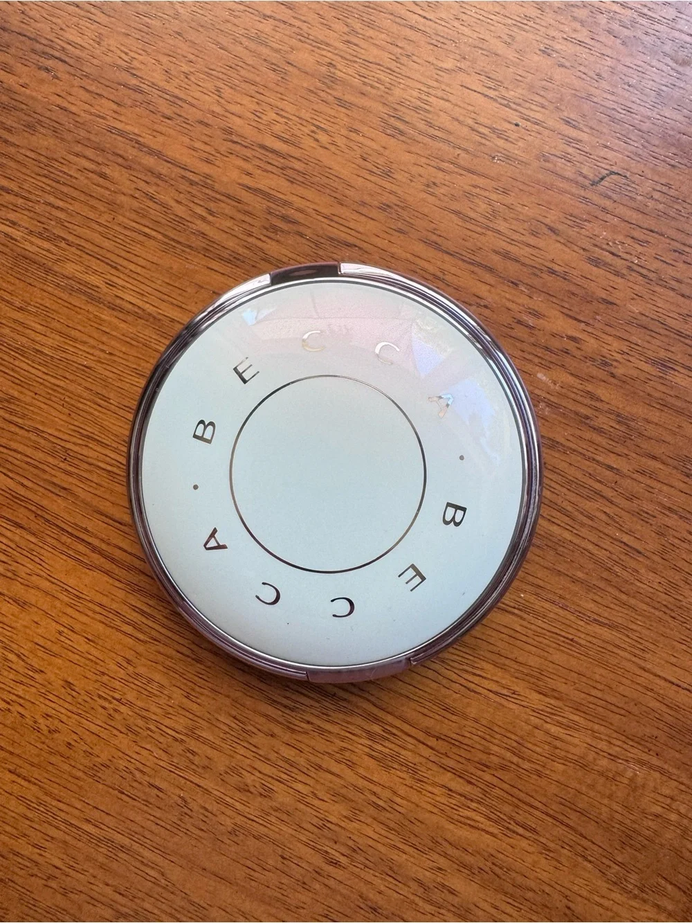 BECCA Shimmering Champagne Highlighter Compact in Pure Pearl